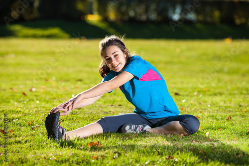 Photo: Woman exercising outdoor Woman exercising outdoor