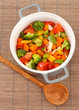 Vegetable stew in gray pot on bamboo mat background