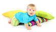 Little boy and color pillows, isolated on white