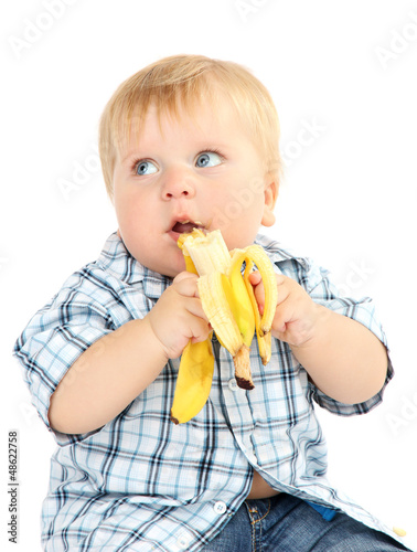 Photo: Little boy with banana, isolated on white Little boy with banana, isolated on white