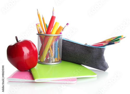 Photo: pencil box with school equipment and apple isolated on white pencil box with school equipment and apple isolated on white