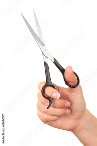 Photo: Female hand with scissors isolated on white Female hand with scissors isolated on white