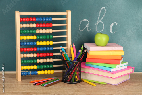 Photo: Toy abacus, books and pencils Toy abacus, books and pencils