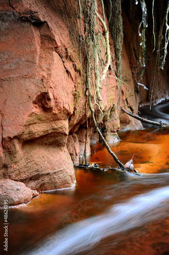 Photo: small river scene among rocky valley small river scene among rocky valley