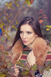Photo: portrait of a beautiful girl in autumn leaves portrait of a beautiful girl in autumn leaves