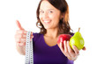 Woman with apple, pear and measuring tape