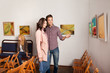 young attractive couple in art gallery