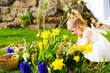 Girl on Easter egg hunt with eggs
