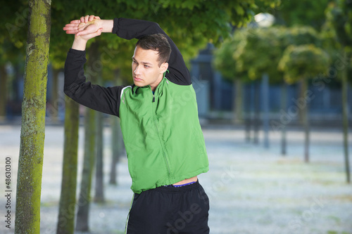 Photo: Young Man Stretching Young Man Stretching