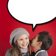 Boy talking to girl over red background with balloon. 