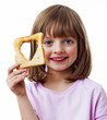 Photo: little girl holding bread on white background little girl holding bread on white background
