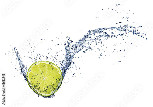 Photo: Fresh lime in water splash, isolated on white background Fresh lime in water splash, isolated on white background