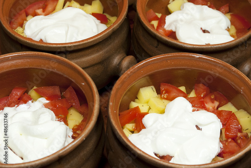 Photo: Vegetables for cooking with sour cream in pots Vegetables for cooking with sour cream in pots