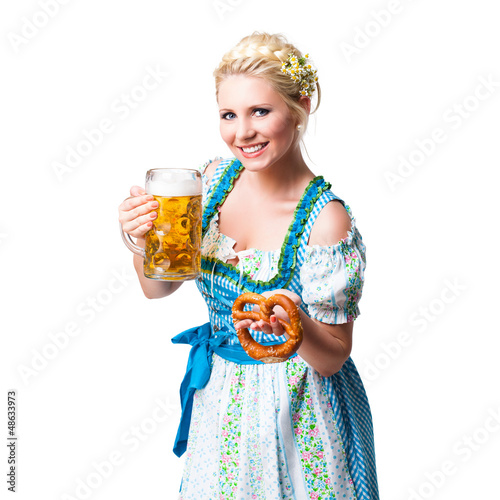 Photo: junge blonde Frau im Dirndl mit Masskrug und Brezn junge blonde Frau im Dirndl mit Masskrug und Brezn