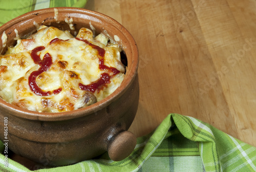 Photo: Meat and vegetables with cheese and ketchup in a pot Meat and vegetables with cheese and ketchup in a pot