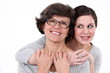 Mother and daughter hugging