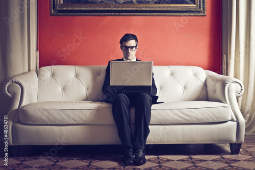 Photo: businessman working on sofa businessman working on sofa