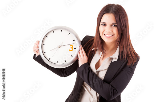 Photo: Businesswoman holding a clock Businesswoman holding a clock