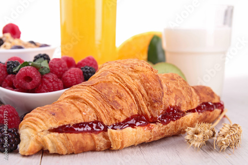 Photo: close up on croissant with fruits close up on croissant with fruits
