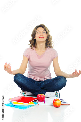Photo: Young pretty female student with red apple isolated on white Young pretty female student with red apple isolated on white