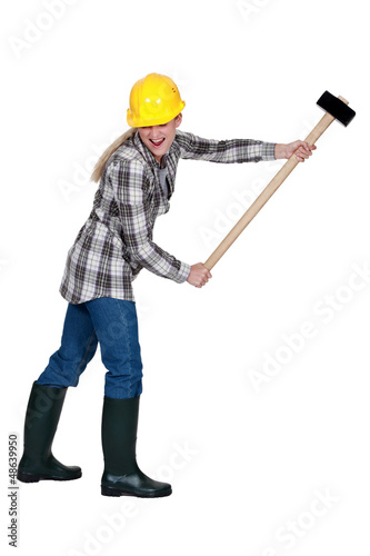 Photo: Woman with large hammer Woman with large hammer