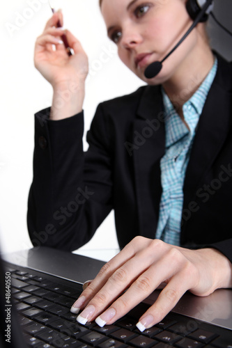 Photo: call-center worker with laptop call-center worker with laptop