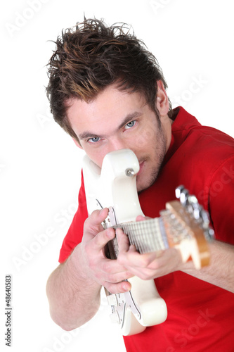 Photo: Young man playing the guitar Young man playing the guitar
