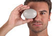 Man holding pebble