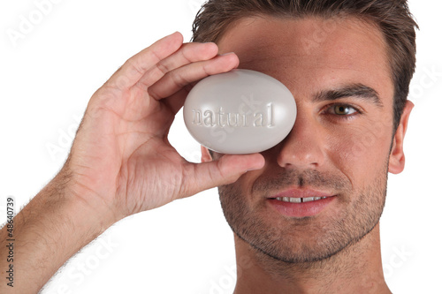 Photo: Man holding pebble Man holding pebble
