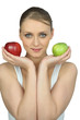 Young woman holding a red and a green apple
