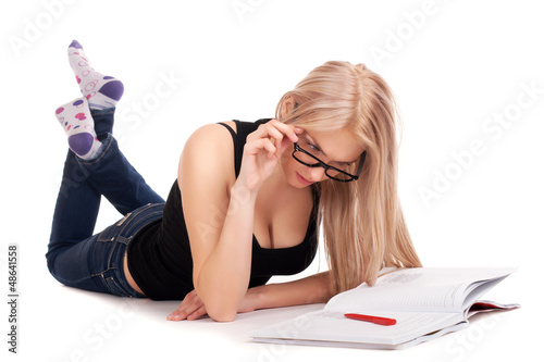 Photo: Student lying and studying Student lying and studying