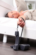 Woman laying in bed with house phone