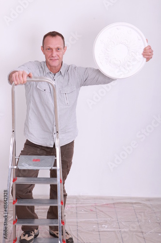 Photo: Man climbing step-ladder Man climbing step-ladder