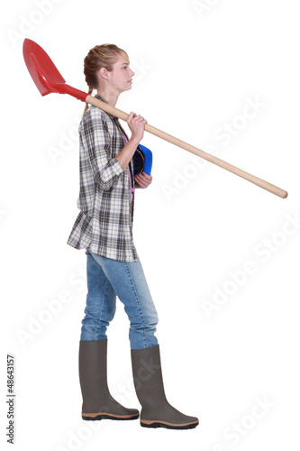 Photo: Woman with spade and hard hat Woman with spade and hard hat