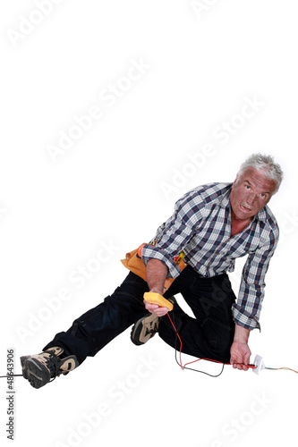Photo: electrician falling down after an electrical shock electrician falling down after an electrical shock