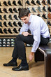 Young man trying on shoes