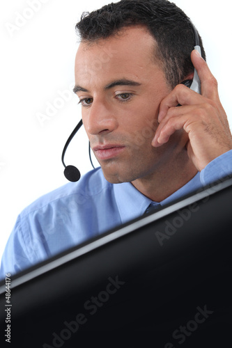 Photo: businessman wearing a headset businessman wearing a headset