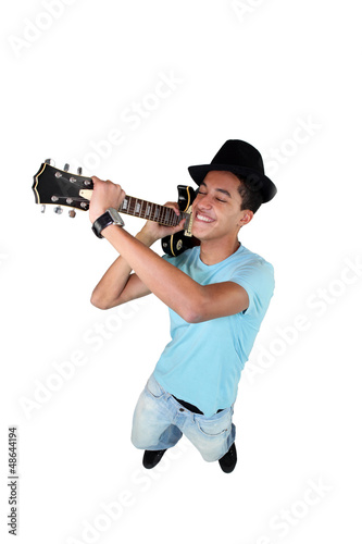 Photo: teenager playing guitar teenager playing guitar