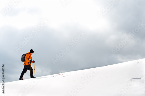 Photo: Hiker going up on a slope Hiker going up on a slope