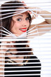 sexy woman looking through the blinds
