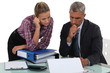 Boss explaining point to colleague