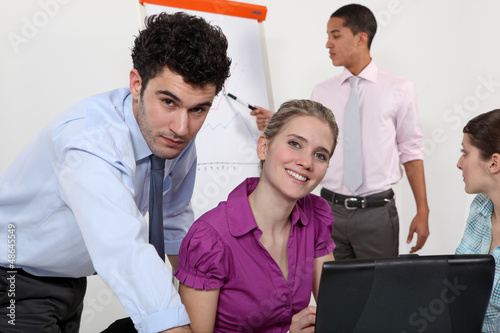 Photo: Businesspeople working together on project Businesspeople working together on project