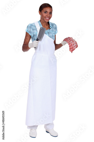 Photo: Woman butcher with ax and meat piece Woman butcher with ax and meat piece