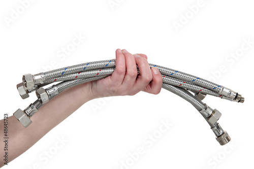 Photo: Plumber holding metal pipes Plumber holding metal pipes