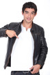 Man in leather jacket pointing at blank message board
