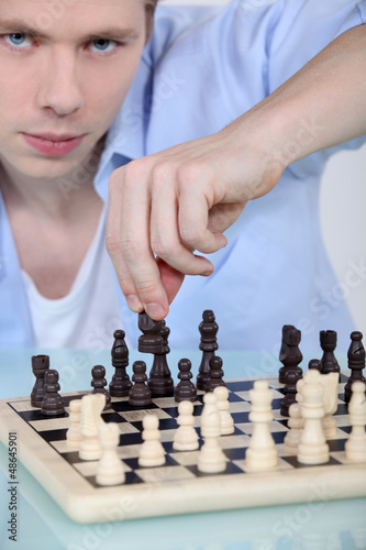 Photo: Man playing chess Man playing chess