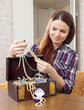  pretty girl chooses jewelry in treasure chest