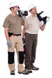 Workmen holding drills
