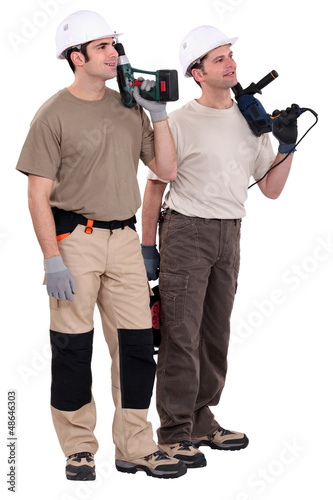 Photo: Workmen holding drills Workmen holding drills