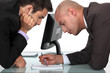 Businessmen looking through notes